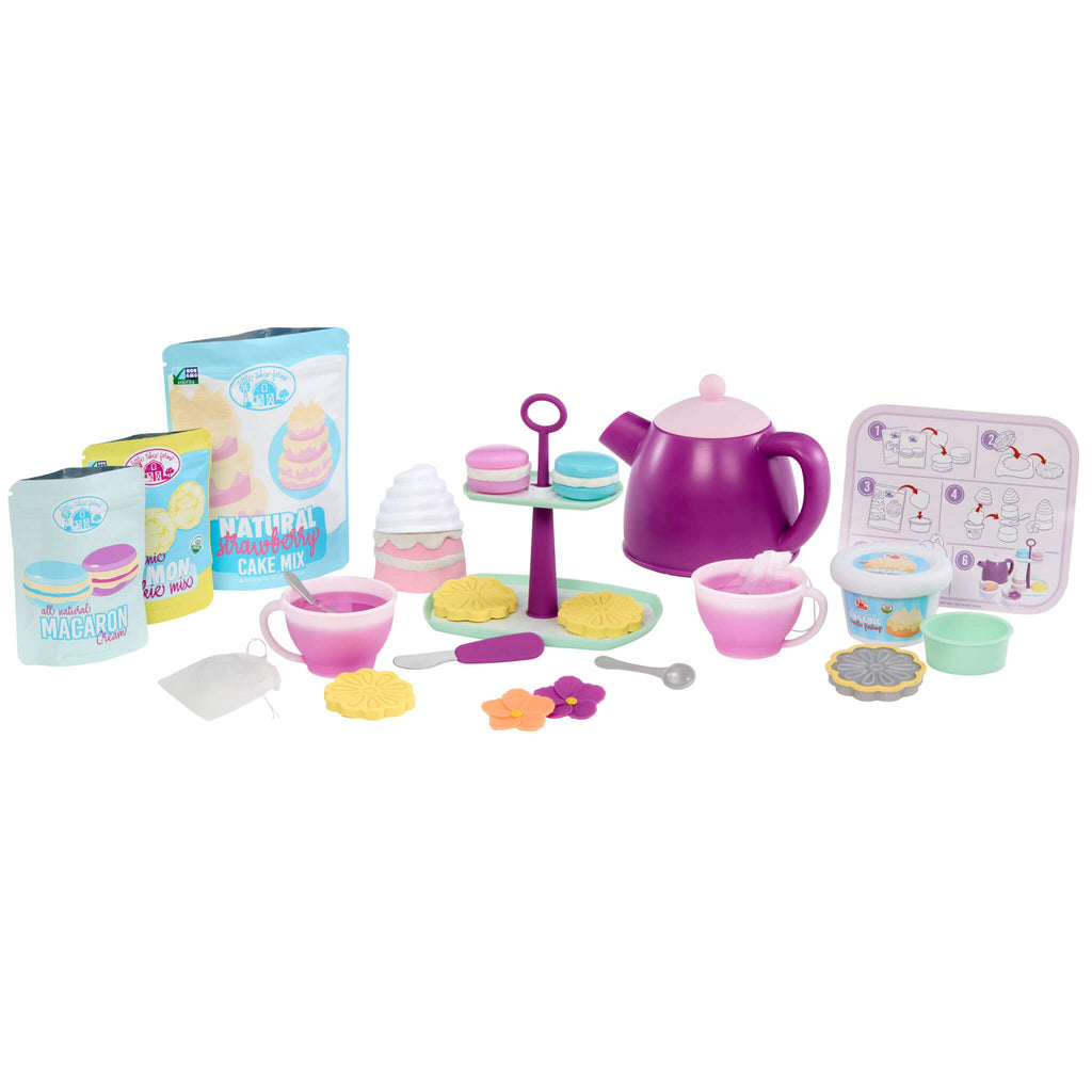 Children's toy tea set with various items on a white background